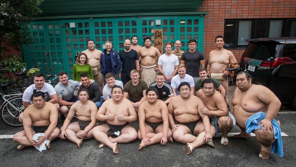 Ireland players and management pose for a photo with sumo wrestlers at Shikoroyama-beya in Koto-ward in Tokyo. Photograph: Ryan Byrne/Inpho