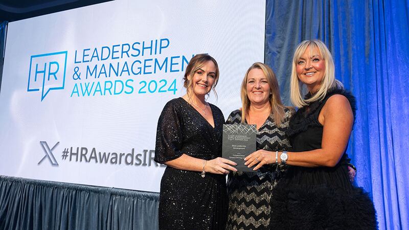 Sinead Healy, principle consultant, presents the best leadership development award to Anita Cummins, Primeline Group