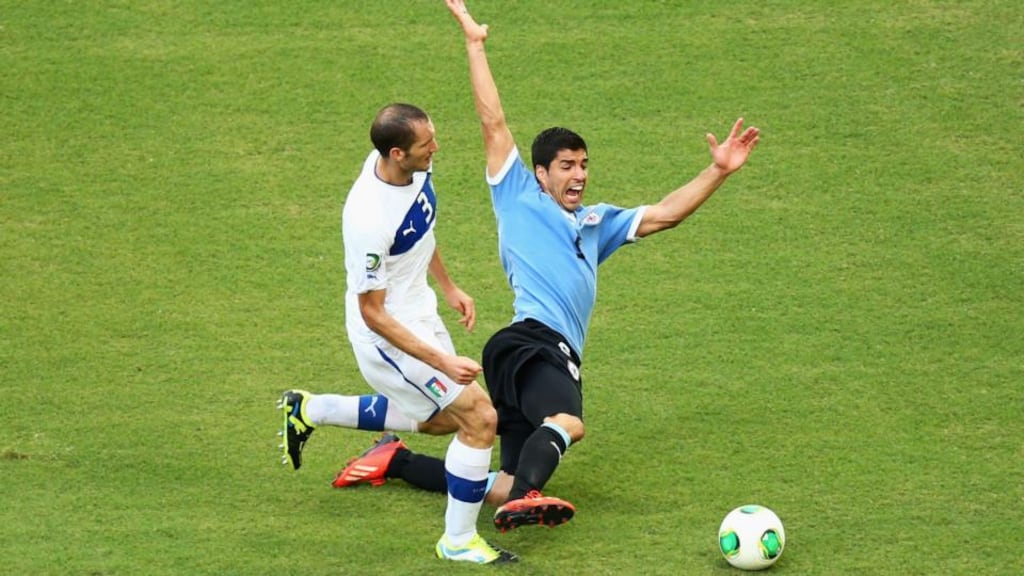 Luis Suraez in action for Uruguay against Italy’s Giorgio Chiellini during the Confederations Cup in Brazil. Photograph: Robert Cianflone/Getty Images