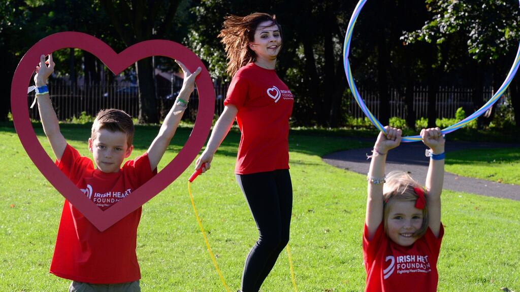 Ellen McMeel, Irish Heart Foundation schools officer, with Sonny and Daisy Conboy during an excerise morning. Photograph: Cyril Byrne