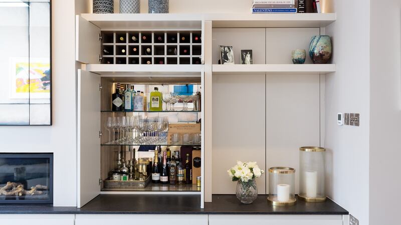 The eat-in kitchen has custom-built cupboards and larders that use every inch of space to best effect