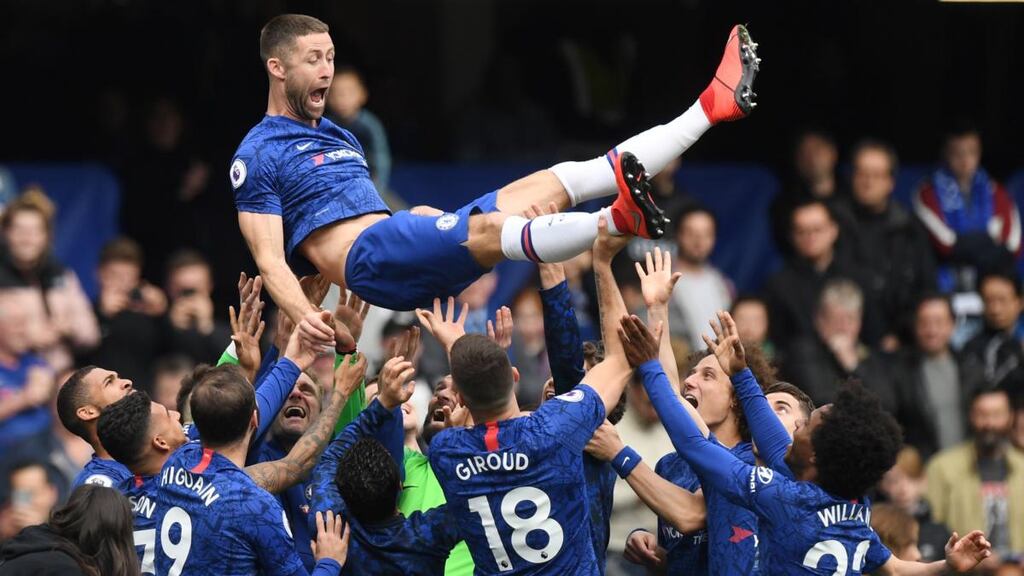 Chelsea’s Gary Cahill is tossed in the air by team-mates on his last appearance for the club at the end of the the English Premier League clash with Watford. Photograph: Facundo Arrizabalaga/EPA