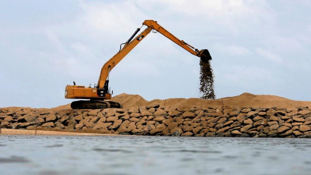 Construction requires sand with angular grains, found in rivers and other water sources. Photograph: Dinuka Liyanawatte/Reuters