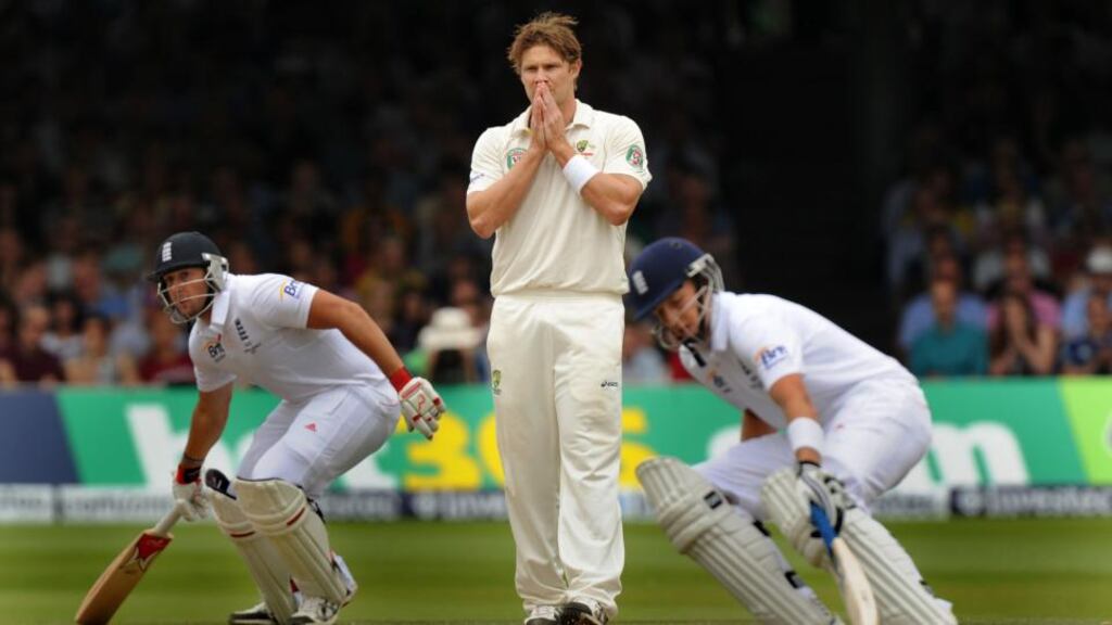 Australia’s Shane Watson (centre) watches as England’s Tim Bresnan (left) and Joe Root (right) put runs on the board on day three of the Second Investec Ashes Test at Lord’s.  Photograph: Anthony Devlin/PA Wire