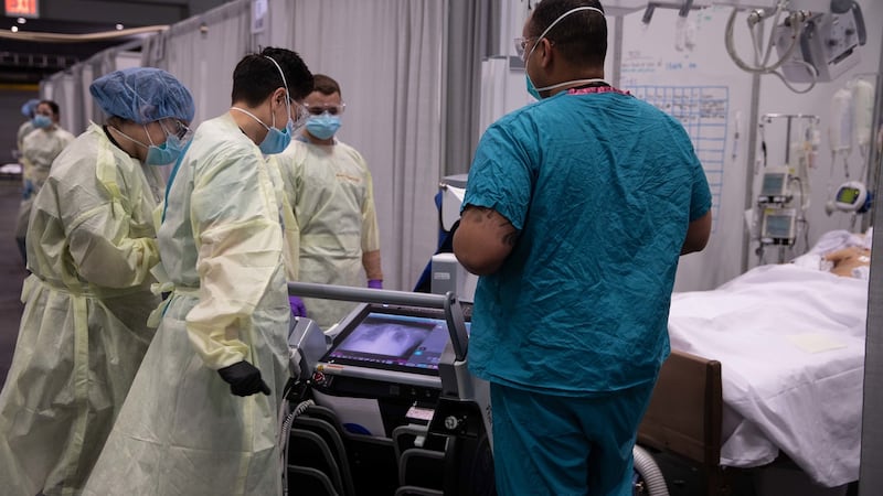 US Army service members from the 531st field hospital examine a patient’s x-ray results at the Javits New York Medical Station in New York on April 18th. Photograph: Cpl Rachel Thicklin/US Army/EPA