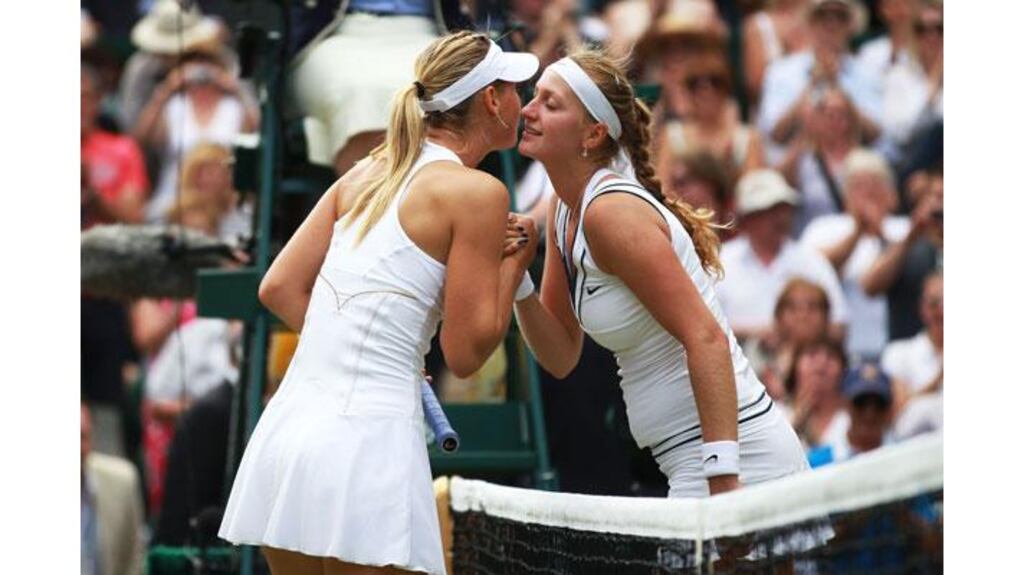 Petra Kvitova of the Czech Republic kisses Maria Sharapova of Russia after winning the Wimbledon women's final. Photograph: Julian Finney/Getty Images