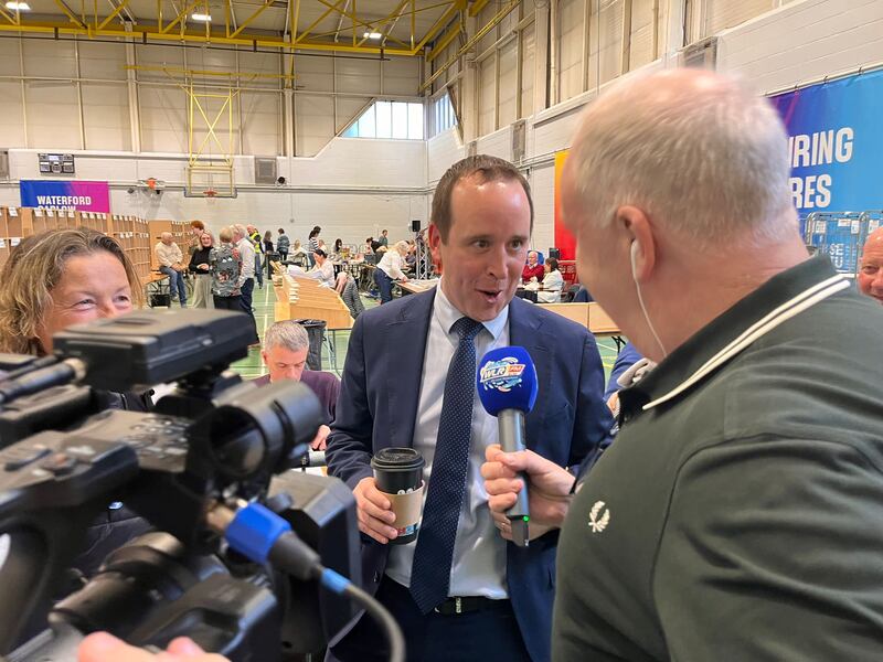 A victorious John Cummins (Fine Gael) outlines to Damien Tiernan of WLR and Déise Today how they got their strategy right this time. There was a loud cheer when Tiernan asked his father, former senator Maurice Cummins, if his son was ministerial material. At 37, he has been described as being the Waterford equivalent of Simon Harris. Photograph: Kevin O'Sullivan