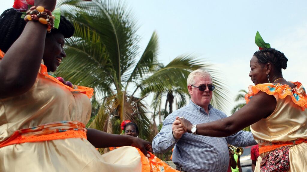 Eamon Gilmore engages in traditional Colombian dance during a visit to Caloto by the EU envoy to the country’s peace process. Photograph: Christian Escobar Mora/EPA