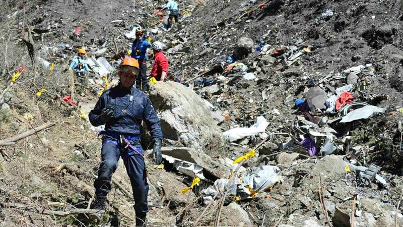 French gendarmes and investigators make their way through debris from wreckage on the mountainside at the crash site of the Airbus A320, near Seyne-les-Alpes. Photograph: Reuters/French Interior Ministry/DICOM/F Pellier /Handout TPX