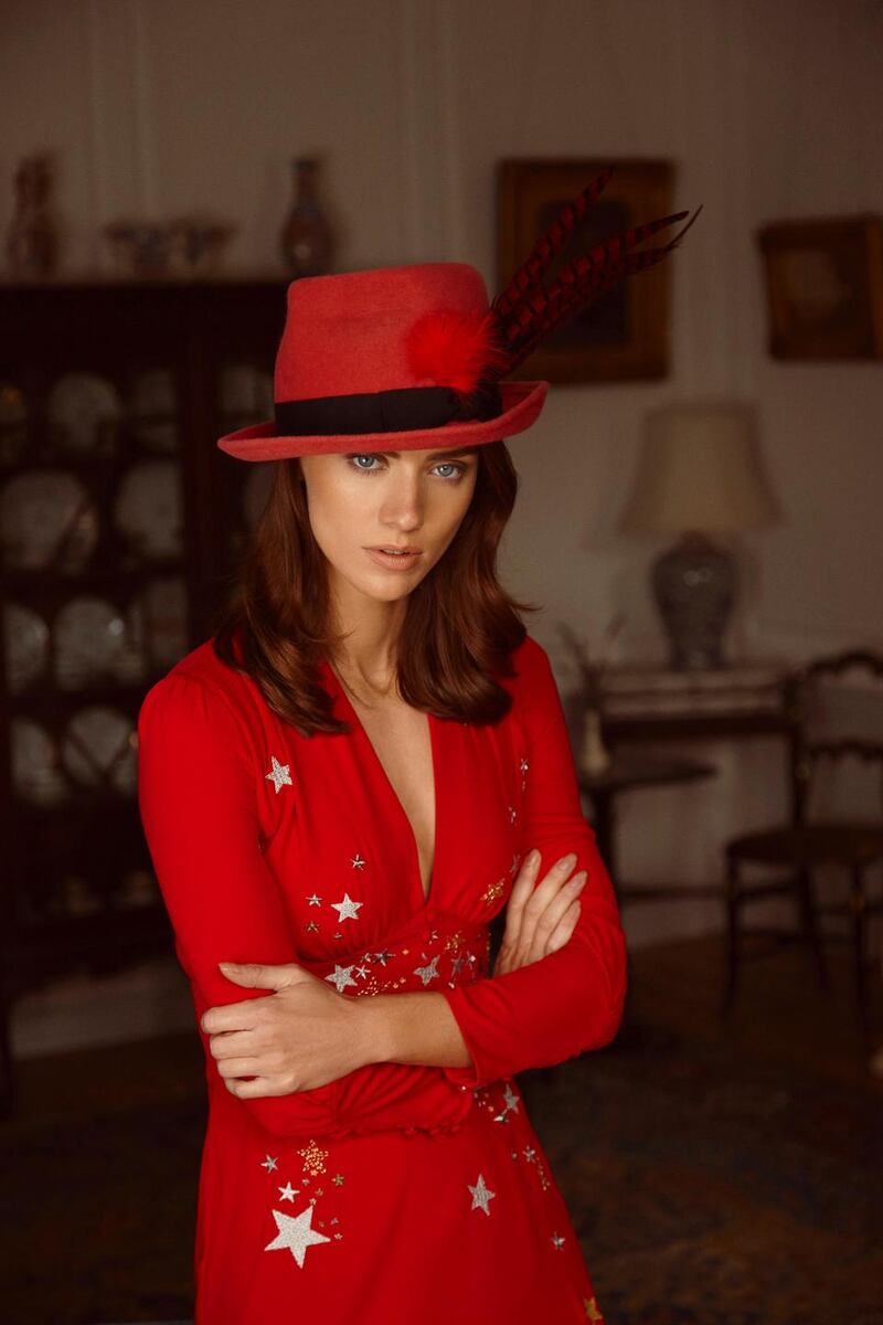Red silk dress with embroidered stars and moons (€380, Rixo, Brown Thomas), faux snakeskin boots River Island, pink trilby with twisted crown and pheasant feather (€250 Anthony Peto)