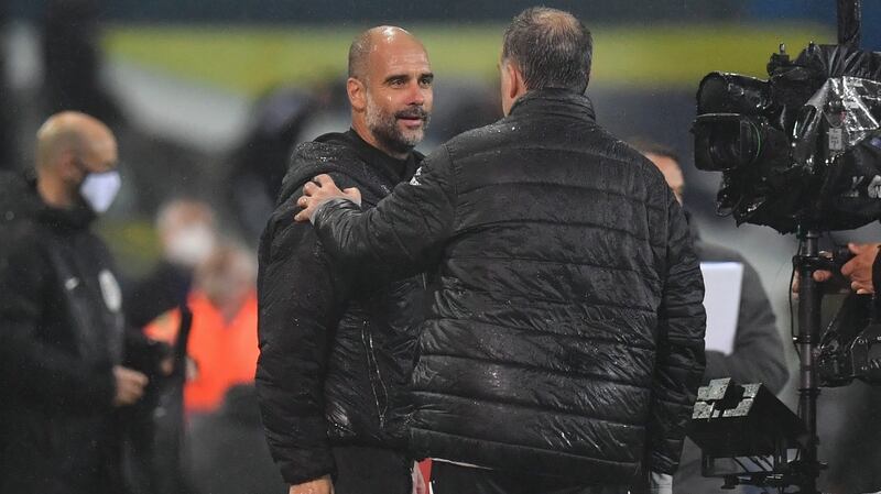 Manchester City manager Pep Guardiola talks to Leeds United boss Marcelo Bielsa after Saturday’s Premier League game at Elland Road. Photograph: Jason Cairnduff/EPA