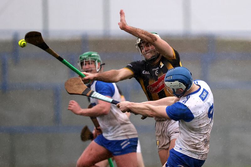 Kilkenny's Paddy Deegan moves in to block Paddy Leavey of Waterford. Photograph: Bryan Keane/Inpho