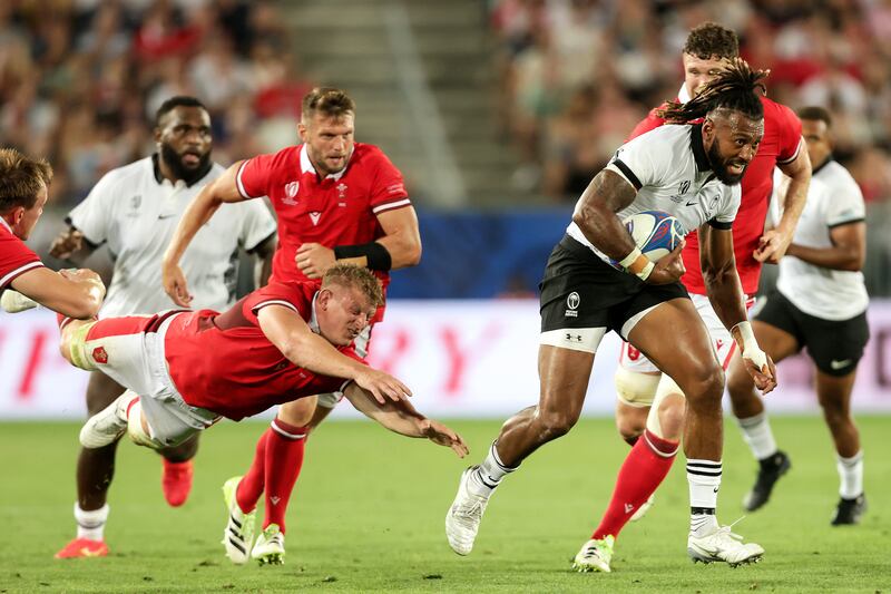 Fiji's Waisea Nayacalevu gets past Jac Morgan of Wales during the rousing Rugby World Cup Pool C clash at Stade de Bordeaux. Photograph: Laszlo Geczo/Inpho