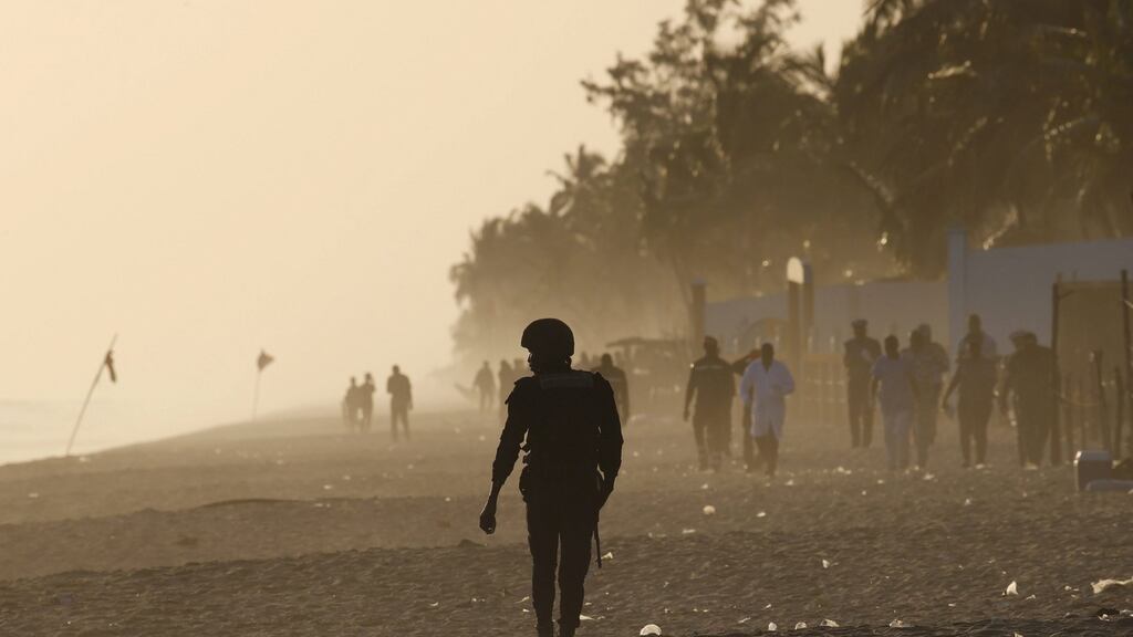 A security officer walks on the beach after an attack in Grand Bassam, Ivory Coast, on Sunday. Photograph: Reuters/Joe Penney