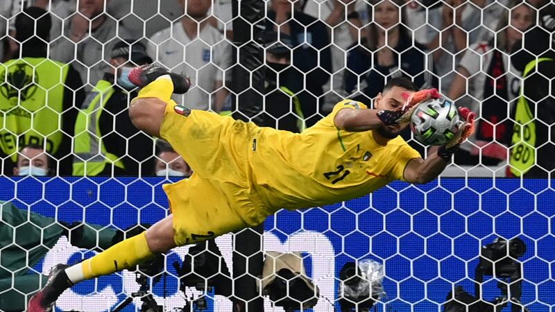 Italy’s goalkeeper Gianluigi Donnarumma saves a shot by England’s forward Jadon Sancho in the penalty shootout. Photograph: Paul Ellis/Pool/AFP via Getty