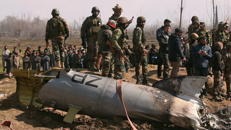 Indian soldiers stand next to the wreckage of an Indian Air Force helicopter after it crashed in Budgam district in Kashmir on Wednesday. Photograph: Danish Ismail/Reuters
