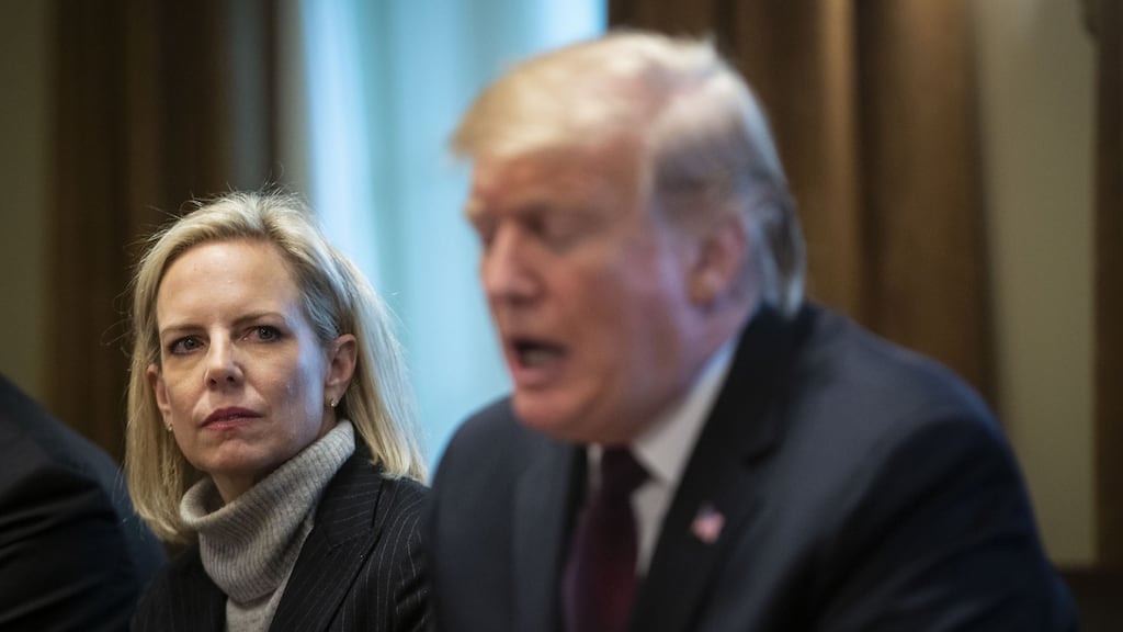 Kirstjen Nielsen with Donald Trump, who dismissed her as secretary for homeland security despite the fact that she fully implemented his successful testing of the most basic human boundaries. Photograph: Al Drago/Bloomberg via Getty Images