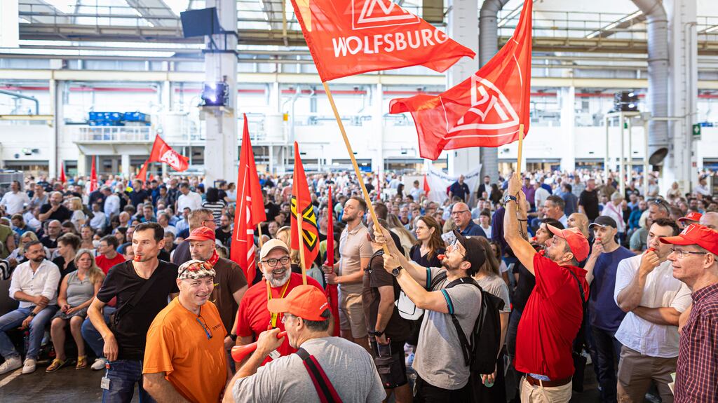 Volkswagen employees protest at the start of a general meeting in Wolfsburg, Germany, on Wednesday. Volkswagen said on September 2nd it could take the unprecedented step to close production sites in Germany. Photograph: Moritz Frankenberg