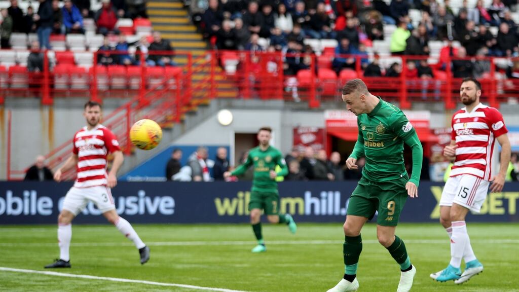 Leigh Griffiths heads home Celtic’s second goal  during the Scottish Premiership match against Hamilton at the SuperSeal Stadium.  Photograph: Jane Barlow/PA Wire