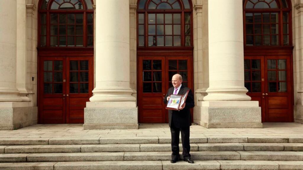 On the wrong road?: Minister for Finance Michael Noonan poses for the media on the steps of Leinster House. Photograph: Cathal McNaughton / Reuters