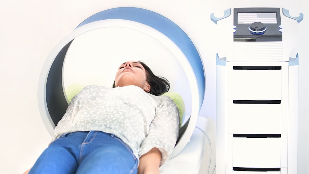 A woman undergoes magnetic-field therapy.