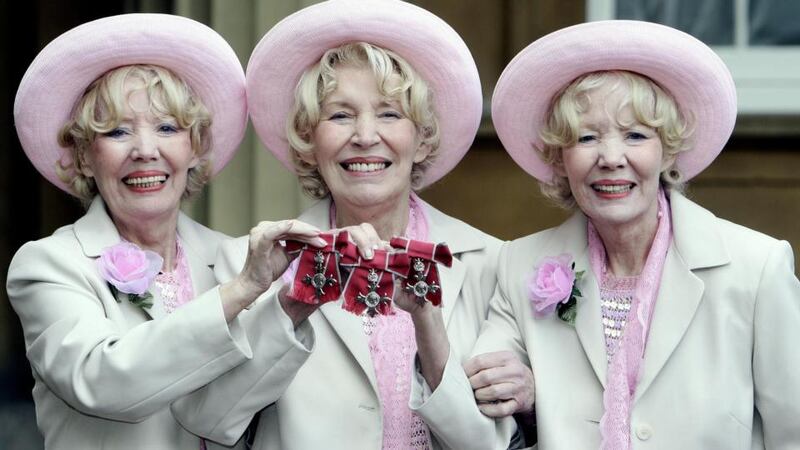 The Beverley sisters Babs, Joy and Teddie holding their MBEs at Buckingham Palace in London. Joy Beverley has died aged 91, after she reportedly suffered a stroke last week. Photograph: PA