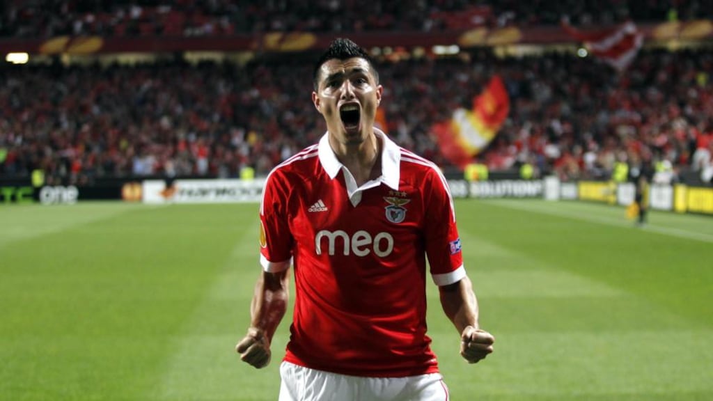 Benfica’s Oscar Cardozo celebrates after scoring his side’s third goal against Fenerbahce during their Europa League semi final second leg soccer match at Benfica’s Luz stadium in Lisbon. Photograph: AP Photo