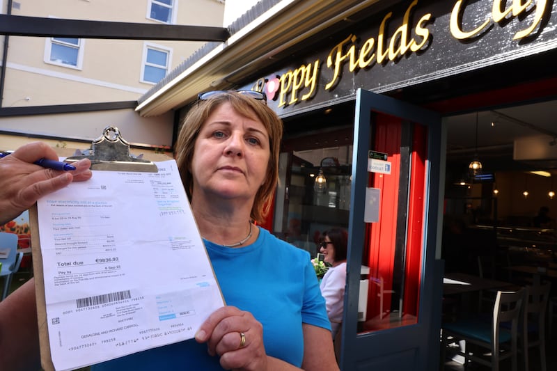Geraldine Dolan at Poppy Fields cafe, Athlone, Co. Westmeath, holds up her electricity bill, almost €10,000 for 73 days. Photograph: Dara Mac Dónaill
Photograph: Dara Mac Donaill / The Irish Times