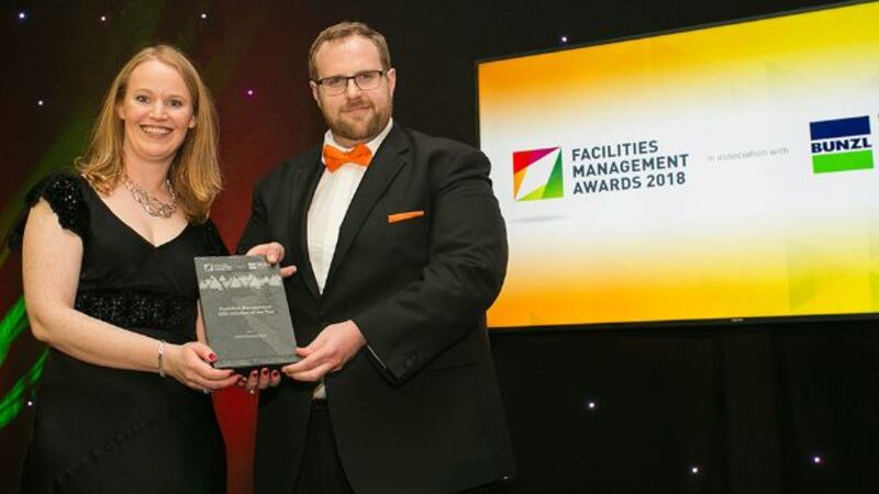 Paraic O’ Lochainn, General Manager, eMaint presents the Facilities Management CSR Initiative of the Year award to Karen Coyle, AIB Environment