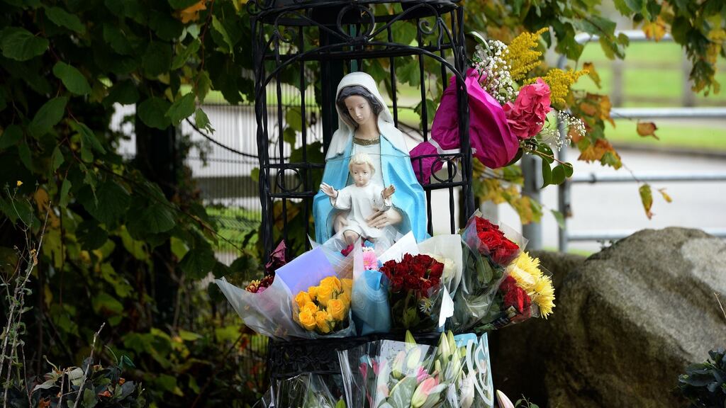 Flowers left in sympathy at the scene of the fire, at the halting site at Glenamuck road , Carrickmines , Co. Dublin. Photograph: Eric Luke / The Irish Times