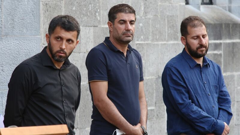 Berun Nasir Abdulla, Dara Ismail and Ahmed Mahmud, cousins of Shahen, at the remembrance service for Karzan, Shahen and baby Lina at NUI Galway. Photograph: Joe O’Shaughnessy