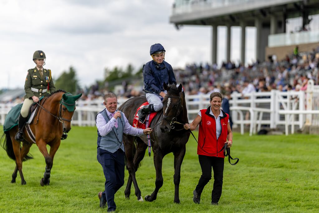 Ryan Moore after victory in the Group One Irish Derby with Lambourn and head lad Pat Keating. Photograph: Morgan Treacy/Inpho