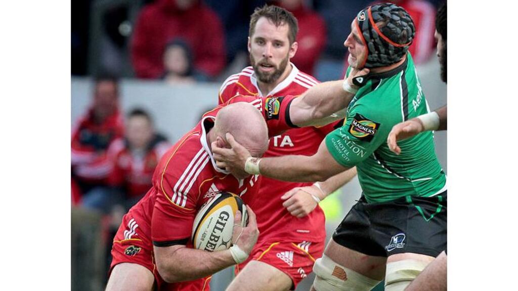 Munster's Paul O'Connell IS tackled by John Muldoon of Connacht at Thomond Park. - (Photograph: Morgan Treacy/Inpho)