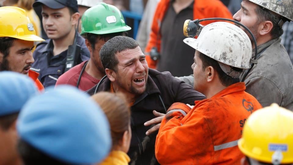 People mourn for their relatives after a mine explosion near Soma, Manisa province. At least 232 people have been killed. Photograph: Tolga Bozoglu/EPA