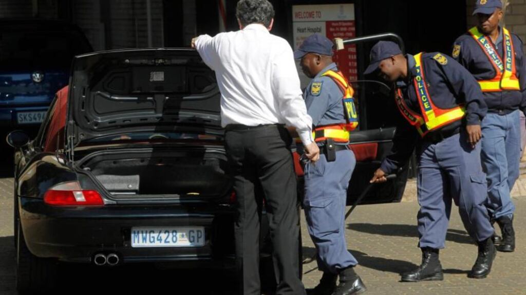 Police search cars as security is stepped up outside a Pretoria hospital where former South African president Nelson Mandela is being treated. Photograph: Mike Hutchings/Reuters  Police search cars as security is stepped up outside a Pretoria hospital where former South African president Nelson Mandela is being treated. Photograph: Mike Hutchings/Reuters
