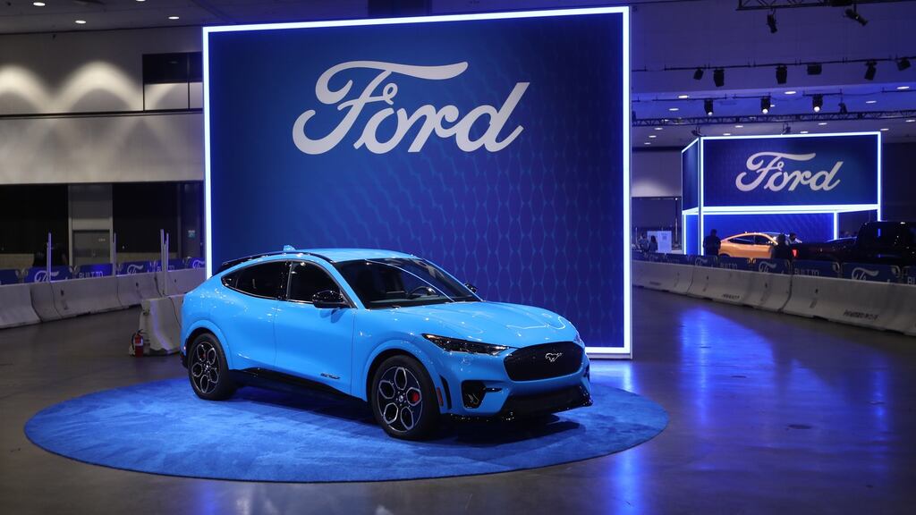 A Ford Mustang on display in Los Angeles. The motor company has decided to push back its return to the office next year from January to March due to a Covid surge in its home state of Michigan. Photograph: EPA/DAVID SWANSON