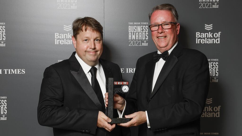 Ciarán Hancock, business editor at The Irish Times presents the Distinguished Leader in Business Award to Pat McCann, former chief executive of Dalata hotel group at the The Irish Times Business Awards 2021. Photograph: Conor McCabe.