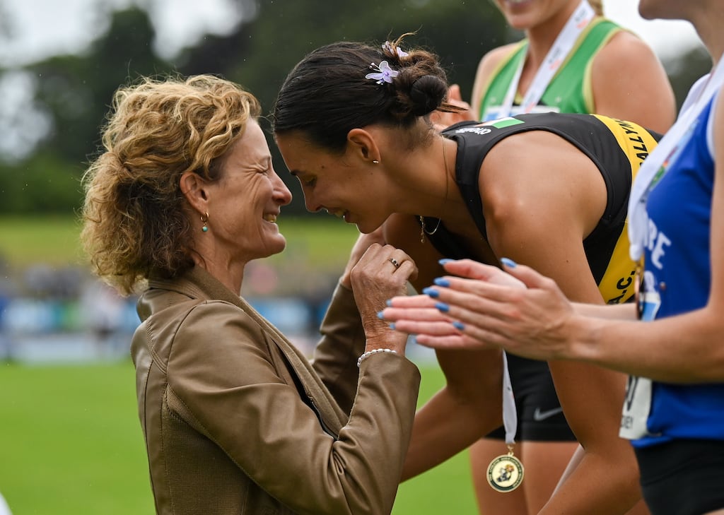 Sophie O'Sullivan is presented with her women's 1500m gold medal by her mother, Olympian Sonia O'Sullivan. Photograph: Sam Barnes/Sportsfile