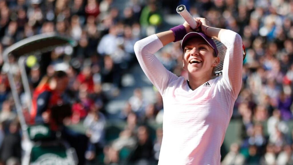 Simona Halep celebrates after beating Svetlana Kuznetsova during their quarter final match at Roland Garros yesterday. Photograph: Christophe Karaba/EPA.