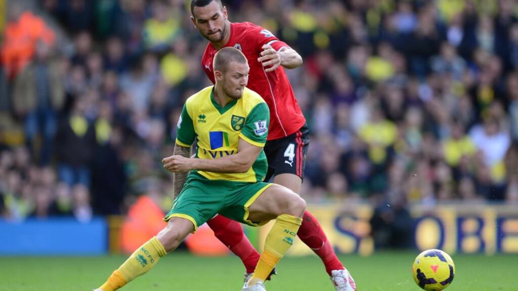Anthony Pilkington in action for Norwich City (left) against his new club Cardiff City at Carrow Road last October. Photograph: Jamie McDonald/Getty Images