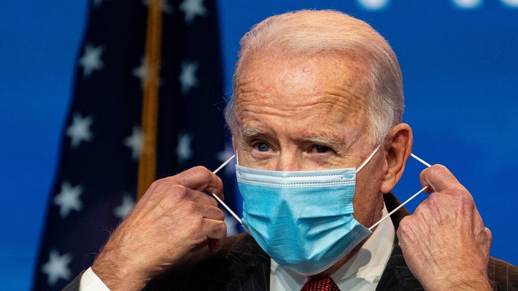 Joe Biden: ‘Just 100 days to mask — not forever, just 100 days. And I think we’ll see a significant reduction.’ Photograph: Ruth Fremson/The New York Times