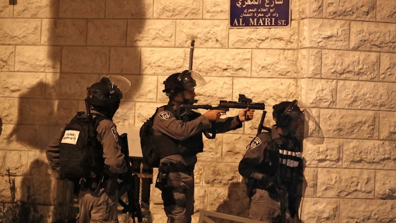 An Israeli soldier aims a tear gas gun in the Palestinian neighbourhood of Shuafat in East Jerusalem. Photograph: Ahmad Gharabli/AFP via Getty