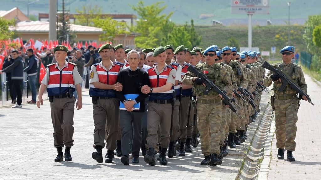 Former Turkish general Akin Ozturk and other arrested soldiers accused of participating in an attempted coup in Turkey last year are paraded by soldiers before a court appearance in Ankara on Monday. Photograph: EPA/STR