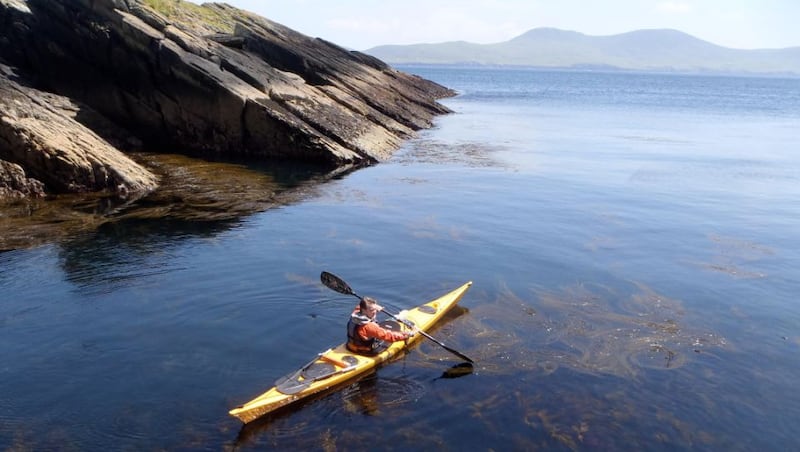 Gary Quinn paddling around Puffin Island with the Kerry mainland in the distance. Photograph: David Quinn