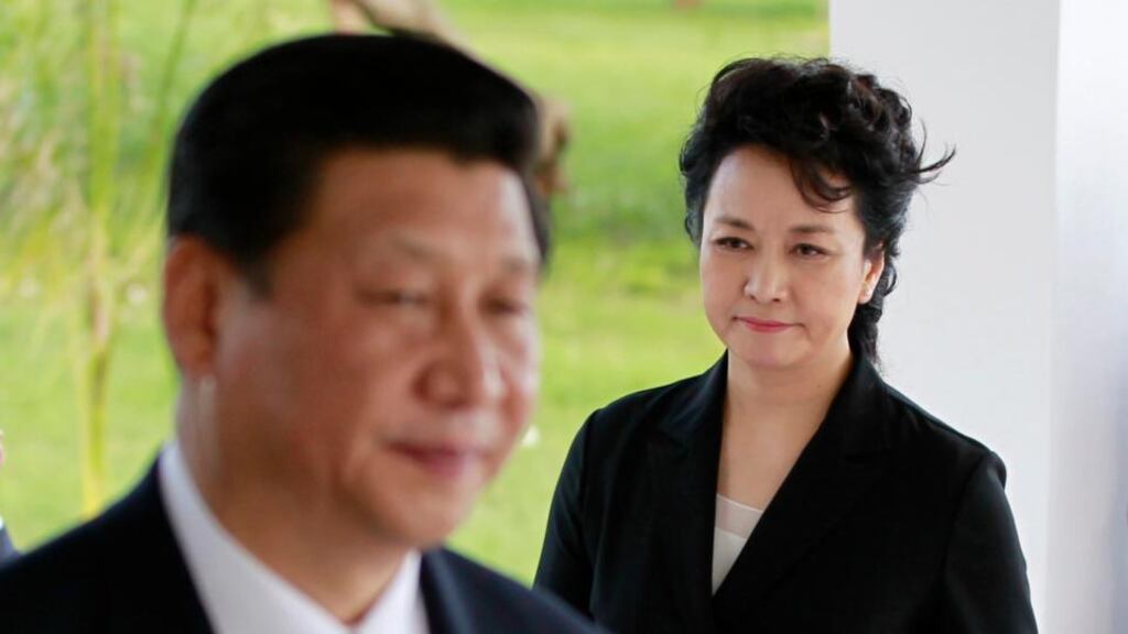 Chinese president Xi Jinping and first lady Peng Liyuan at a ceremony at the Chinese Experts cemetery at Majohe on the outskirts of Dar es Salaam, Tanzania, yesterday. Photograph: Thomas Mukoya/Reuters