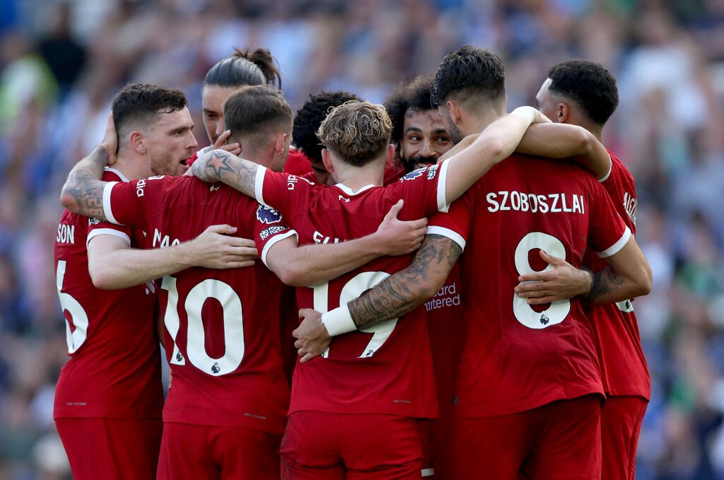 Mohamed Salah celebrates scoring his second goal against Brighton with his Liverpool team mates. Photograph: Steven Paston/PA