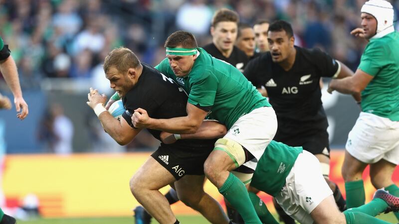 Cody Franks is tackled by Jared Payne during Ireland’s win over the All Blacks in Chicago. Photo: Phil Walter/Getty Images