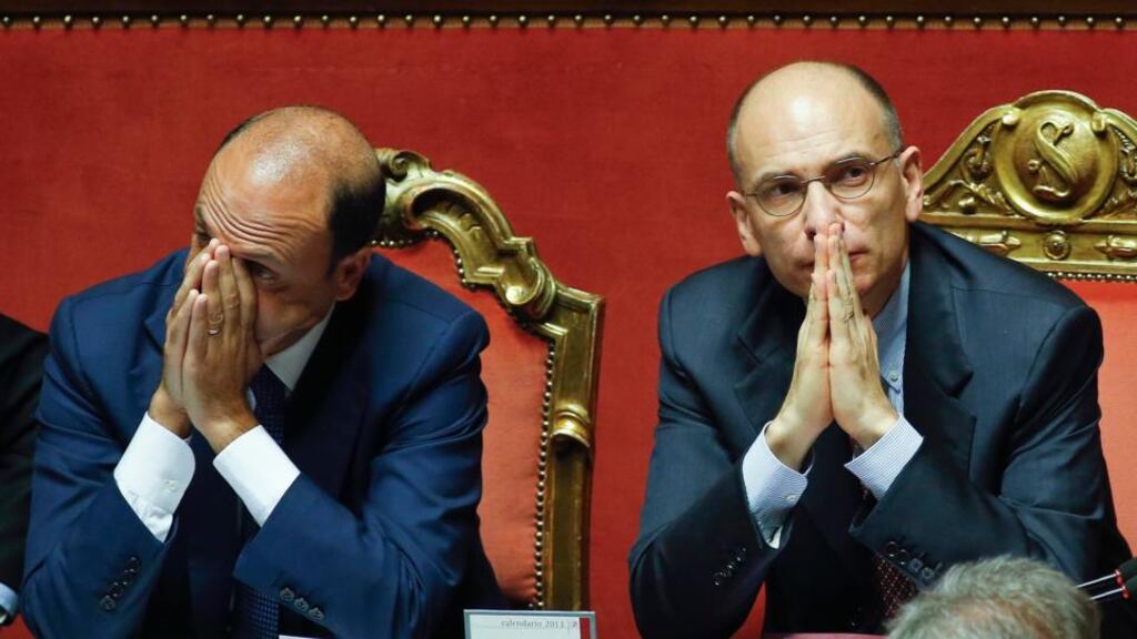 Italy’s Prime Minister Enrico Letta (right) looks on next to Interior minister Angelino Alfano in Rome. Photograph: Reuters.