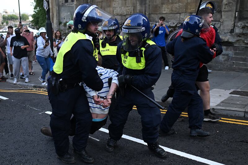 Police arrest protesters as clashes erupt in Bristol on Saturday. Photograph: Justin Tallis/Getty Images/AFP