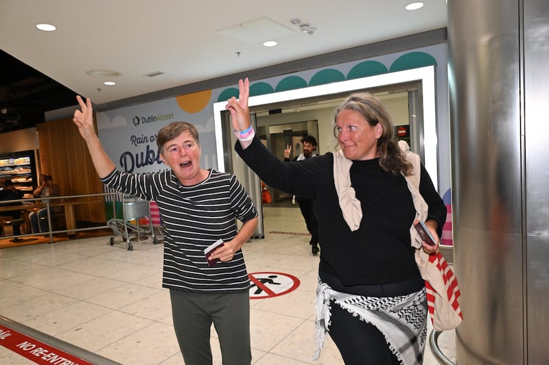 Sarah Clancy (left) and Donna Schwarz arrive home to Dublin Airport after detention in Israel. Photograph: Bryan Meade